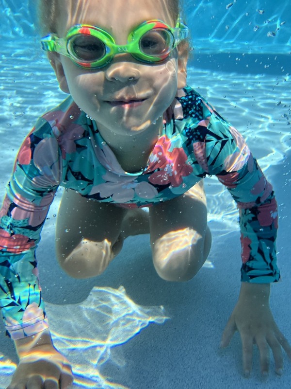 student in pool